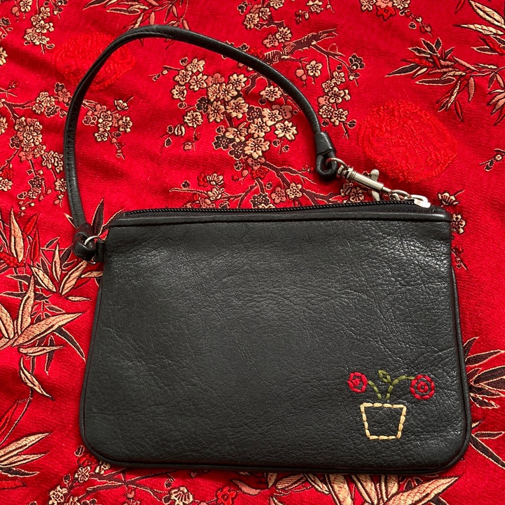 Fossil | leather wristlet with zip closure. Simple, compact and stylish.